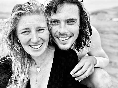 Black and white photo of a couple on the beach